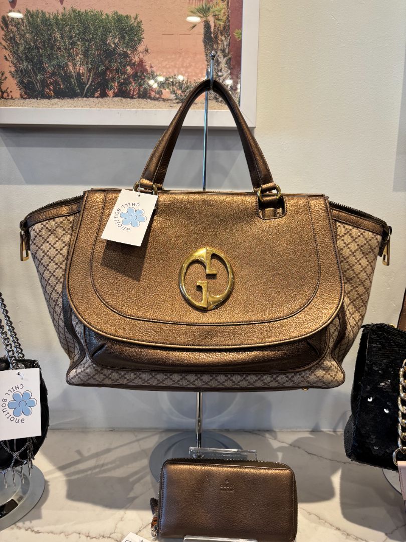 Luxury brown designer handbags consignment collection displayed with gold logo